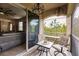 Relaxing screened balcony with wooded views and access to living area at 8256 Enclave Way # 101, Sarasota, FL 34243