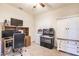 Cozy bedroom showcasing a workspace and jukebox, offering a unique blend of productivity and entertainment at 8256 Enclave Way # 101, Sarasota, FL 34243