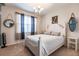 Nautical themed bedroom showcases a white bed frame, charming decor, and soft natural light at 8256 Enclave Way # 101, Sarasota, FL 34243