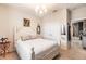 Coastal style bedroom with a chandelier, white furniture, and nautical-themed decor at 8256 Enclave Way # 101, Sarasota, FL 34243