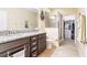 Bathroom boasts granite countertops and walk-in shower at 8256 Enclave Way # 101, Sarasota, FL 34243