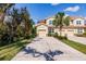 Inviting townhome with a private driveway, attached garage, and mature landscaping at 8256 Enclave Way # 101, Sarasota, FL 34243