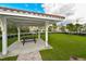 Community picnic gazebo with picnic table, providing a shaded space for outdoor relaxation and gatherings at 8256 Enclave Way # 101, Sarasota, FL 34243
