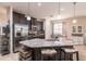 Gourmet kitchen features granite countertops, stainless steel appliances, and stylish bar stool seating at 8256 Enclave Way # 101, Sarasota, FL 34243