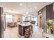 Open concept kitchen with island, stainless steel appliances, and dining area at 8256 Enclave Way # 101, Sarasota, FL 34243