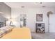 Bright main bedroom featuring calming neutral tones, a tidy shelf unit and ensuite bathroom access at 8256 Enclave Way # 101, Sarasota, FL 34243