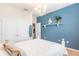 Bedroom with blue accent wall and decorative shelving at 8256 Enclave Way # 101, Sarasota, FL 34243
