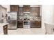 Modern kitchen with stainless steel appliances and granite countertops at 8256 Enclave Way # 101, Sarasota, FL 34243