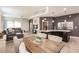 Open concept dining area with wooden table and view of living room at 8256 Enclave Way # 101, Sarasota, FL 34243