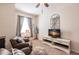 Relaxing bedroom featuring two armchairs and a flat-screen TV at 8256 Enclave Way # 101, Sarasota, FL 34243