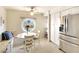 Bright kitchen featuring stainless steel appliances, custom white cabinets and a charming breakfast nook with round window at 8706 54Th W Ave # 18, Bradenton, FL 34210