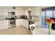 Bright kitchen featuring stainless steel appliances and white cabinetry at 8706 54Th W Ave # 18, Bradenton, FL 34210