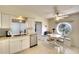 Well-lit kitchen with granite counters and a cozy breakfast nook area at 8706 54Th W Ave # 18, Bradenton, FL 34210