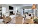 Bright living room featuring a fireplace, a large screen TV, and comfortable furniture at 8706 54Th W Ave # 18, Bradenton, FL 34210