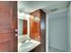 Bathroom with granite countertop and dark wood cabinets at 8706 54Th W Ave # 18, Bradenton, FL 34210