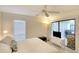 King-size bed in bright bedroom with access to private balcony at 8706 54Th W Ave # 18, Bradenton, FL 34210
