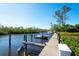 Wooden dock with boat slips and access to the water at 8706 54Th W Ave # 18, Bradenton, FL 34210