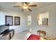 Bright living room features a view into the kitchen, ceiling fan, and tiled floors at 8706 54Th W Ave # 18, Bradenton, FL 34210