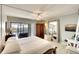 Spacious main bedroom with large mirror and sliding doors to balcony at 8706 54Th W Ave # 18, Bradenton, FL 34210