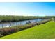 Beautiful waterfront view with boats docked along the canal at 8706 54Th W Ave # 18, Bradenton, FL 34210