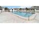 Refreshing community pool with surrounding fence and patio area at 9717 Santa Maria Ct, Bradenton, FL 34210