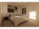 Guest bedroom with striped bedding and contemporary decor at 13028 Cedar Elm Lane, Parrish, FL 34219