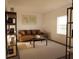 Cozy living room featuring a brown leather sofa and a coffee table at 13028 Cedar Elm Lane, Parrish, FL 34219