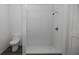 Clean bathroom with a shower and toilet at 13028 Cedar Elm Lane, Parrish, FL 34219