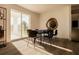 Bright dining area with table and chairs, near sliding glass doors at 13028 Cedar Elm Lane, Parrish, FL 34219