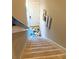 Carpeted staircase leading to upper level at 13507 Messina Loop # 102, Bradenton, FL 34211