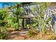 Private backyard oasis with lush tropical landscaping at 1717 Pelican Cove Rd # 334, Sarasota, FL 34231