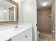 Bathroom features a vanity with a white countertop and a shower at 1717 Pelican Cove Rd # 334, Sarasota, FL 34231