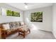 Cozy bedroom with a futon and ottoman, offering a flexible space at 1717 Pelican Cove Rd # 334, Sarasota, FL 34231