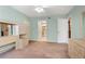 Spacious bedroom with mirrored closet and neutral carpeting at 1717 Pelican Cove Rd # 334, Sarasota, FL 34231