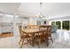 Open concept dining area with kitchen and living room views at 1717 Pelican Cove Rd # 334, Sarasota, FL 34231