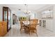 Condo dining room with built-in hutch and chandelier at 1717 Pelican Cove Rd # 334, Sarasota, FL 34231