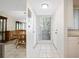 Bright and airy condo entryway with tiled floor and mirrored wall at 1717 Pelican Cove Rd # 334, Sarasota, FL 34231
