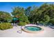 Relaxing hot tub surrounded by lush landscaping at 1717 Pelican Cove Rd # 334, Sarasota, FL 34231
