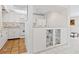 Kitchen features white cabinets, tile floors, and a breakfast bar at 1717 Pelican Cove Rd # 334, Sarasota, FL 34231