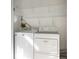 Laundry room with washer and dryer, and overhead shelving at 1717 Pelican Cove Rd # 334, Sarasota, FL 34231