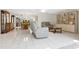 Spacious living room with tile floors, comfortable seating and built in shelving at 1717 Pelican Cove Rd # 334, Sarasota, FL 34231
