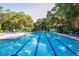 Inviting community swimming pool with lounge chairs at 1717 Pelican Cove Rd # 334, Sarasota, FL 34231