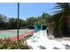 Enjoy resort-style living with community tennis courts and seating area at 1717 Pelican Cove Rd # 334, Sarasota, FL 34231