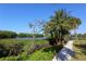 Peaceful waterfront path with lush landscaping at 1717 Pelican Cove Rd # 334, Sarasota, FL 34231