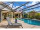 Enjoy this refreshing pool area, complete with a covered lanai and patio at 220 Inlets Blvd, Nokomis, FL 34275