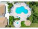 Relaxing pool area with plenty of lounge chairs and a spa at 220 Inlets Blvd, Nokomis, FL 34275