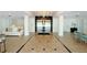 A grand lobby with tile flooring, comfortable seating, and elevator access at 33 S Gulfstream Ave # 307, Sarasota, FL 34236