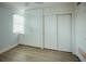 Bright bedroom with wood-look floors and built-in storage at 33 S Gulfstream Ave # 307, Sarasota, FL 34236