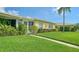 Neatly landscaped front yard with lush green grass at 3712 Hampshire Ln # 5623, Sarasota, FL 34232