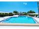Inviting community pool with a patio and lounge chairs at 3712 Hampshire Ln # 5623, Sarasota, FL 34232